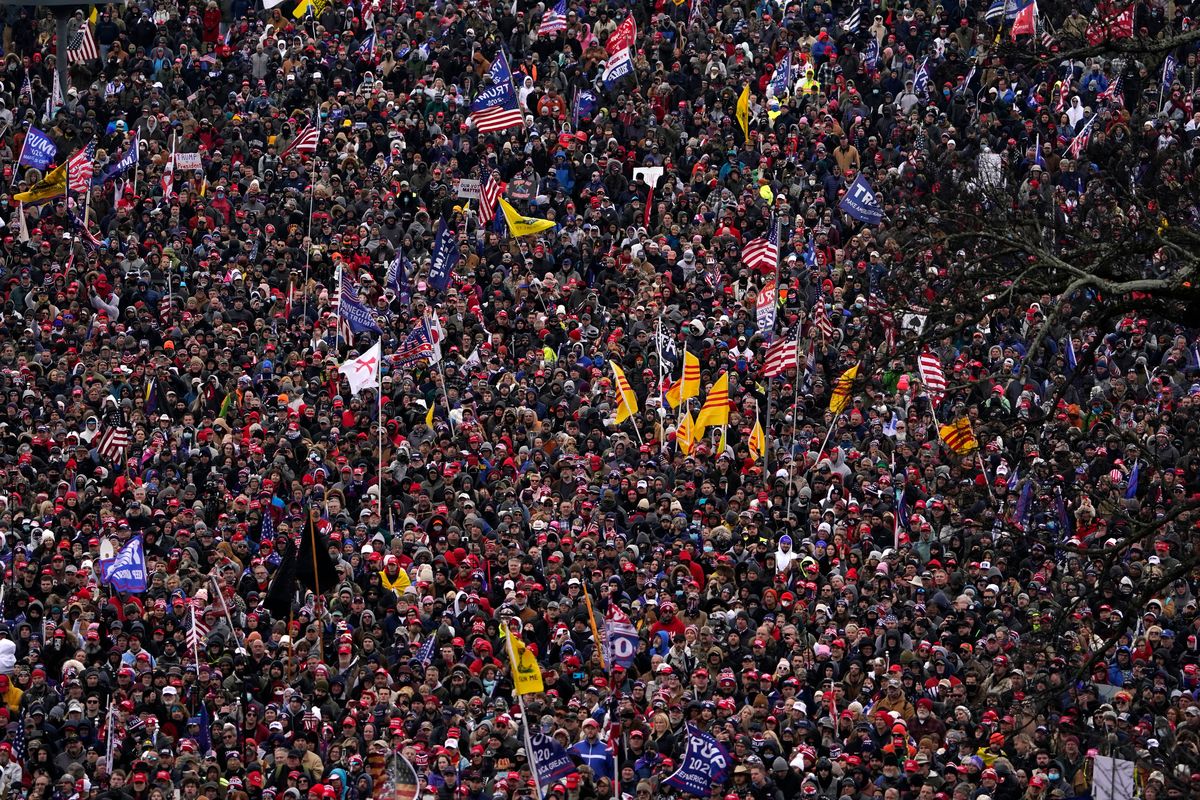 People listen as then-President Donald Trump speaks during a rally Jan. 6, 2021, in Washington. Intelligence reports compiled by the U.S. Capitol Police in the days before last year's insurrection envisioned only an improbable or remote risk of violence, even as other assessments warned that crowds of potentially tens of thousands of pro-Trump demonstrators could converge in Washington to create a dangerous situation.  (Evan Vucci)