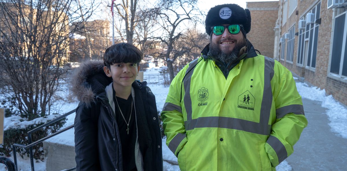 Jamieson Elementary School student Josenrique Rodriguez, left, and crossing guard Joe Sass.