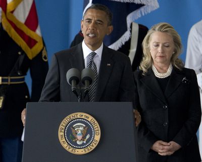 President Barack Obama, accompanied by Secretary of State Hillary Rodham Clinton, speaks during a Transfer of Remains Ceremony, Friday, Sept. 14, 2012, at Andrews Air Force Base, Md., marking the return to the United States of the remains of the four Americans killed this week in Benghazi, Libya. (Carolyn Kaster / Associated Press)