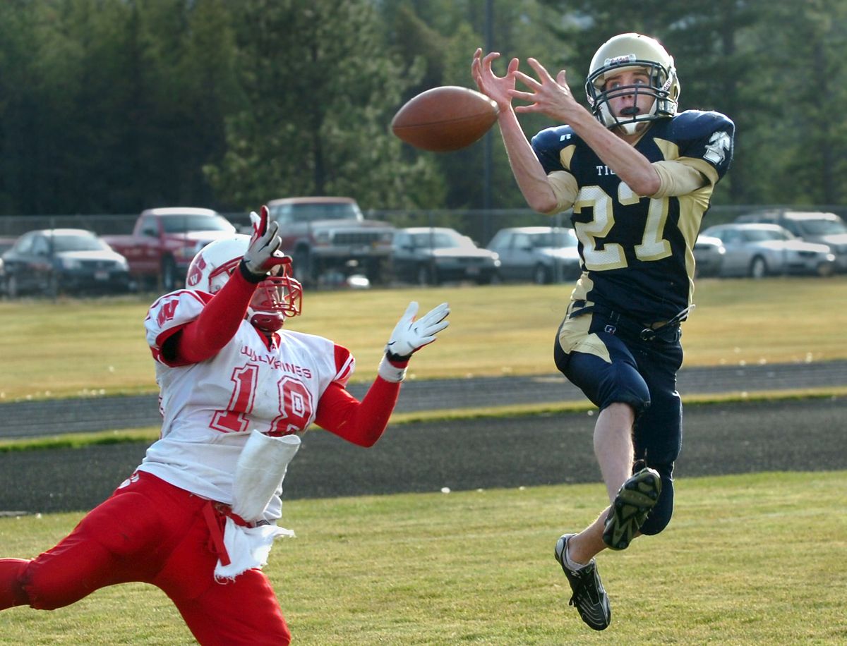 In the state 3A quarterfinals, Timberlake’s Patrick Lagrimanta, right, breaks up a touchdown pass to Weiser’s Brandon Richins,  left, in the end zone Nov. 3 at Timberlake High. (Jesse Tinsley / The Spokesman-Review)