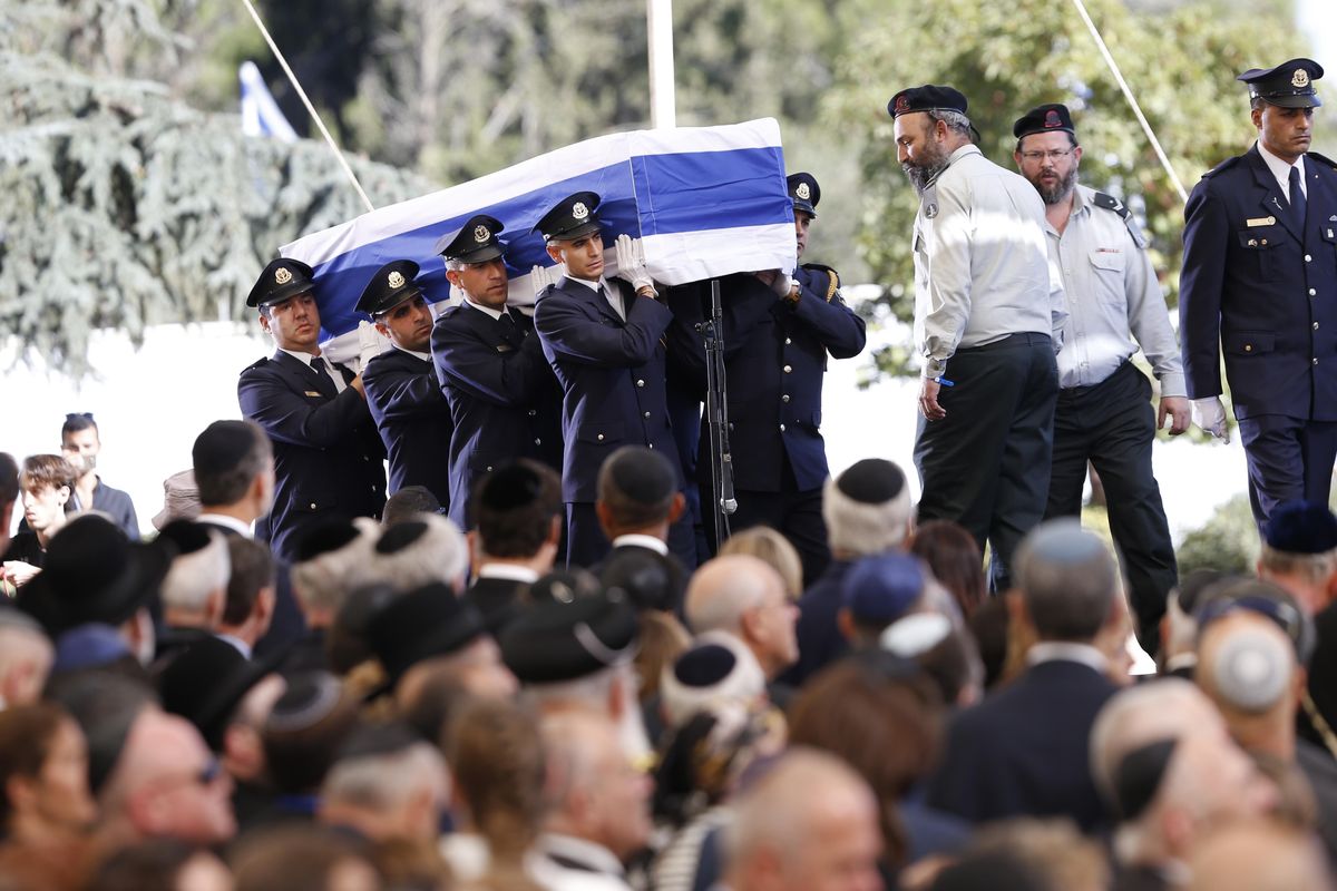 Knesset guards carry the flag-draped coffin during the funeral of former Israeli President Shimon Peres at the Mount Herzel national cemetery in Jerusalem, Friday, Sept. 30, 2016. (Ariel Schalit / Associated Press)