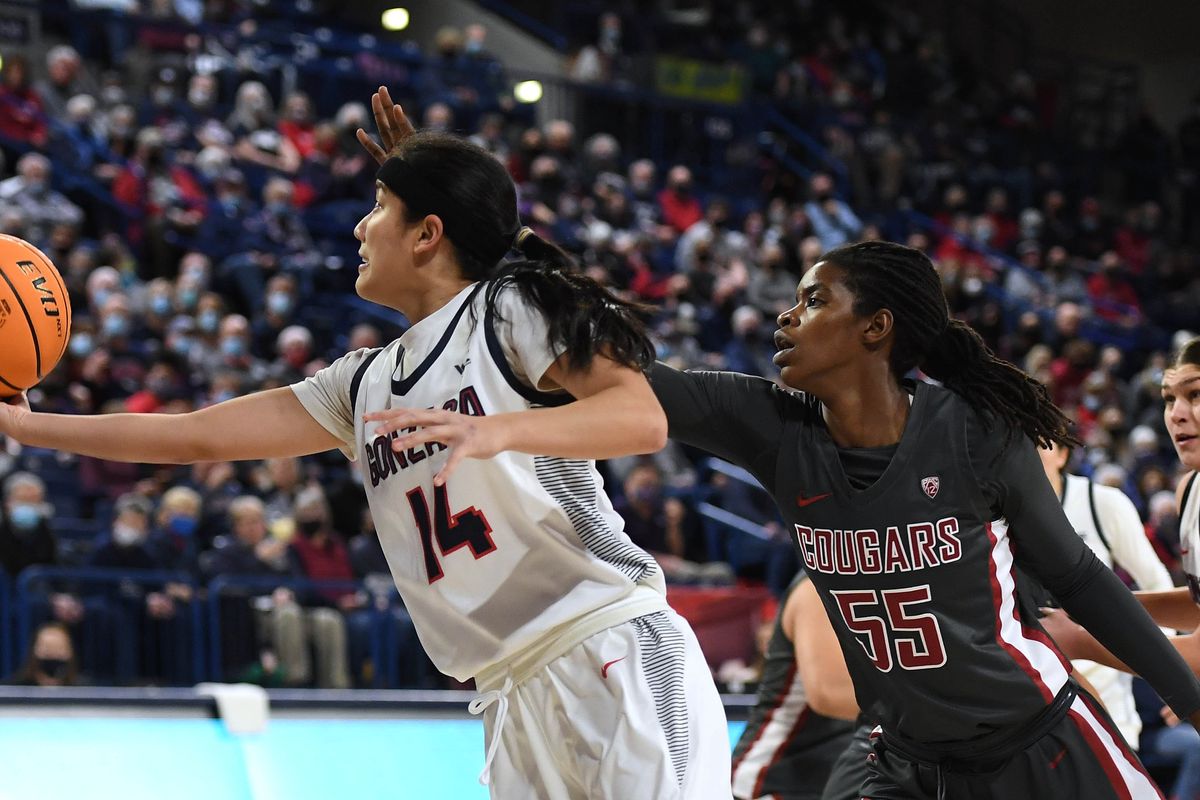 Gonzaga guard Kaylynne Truong (14) heads to the basket as Washington State center Bella Murekatete (55) defends during an NCAA college basketball game, Wednesday, Dec. 8, 2021, in the McCarthey Athletic Center.  (COLIN MULVANY/THE SPOKESMAN-REVIEW)