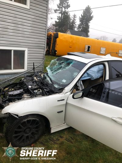 A crash involving a BMW and a school bus is shown in the 21000 block of East Wellesley Avenue in Spokane Valley on Nov. 22. The driver pleaded guilty this week to various charges.  (SVFD Facebook)