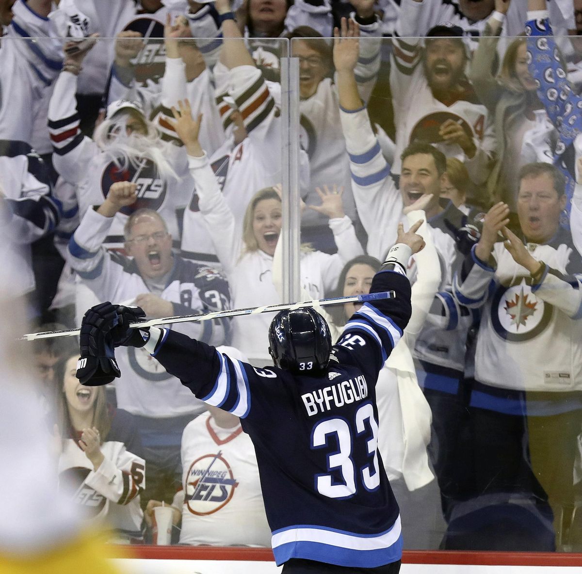 In this May 1, 2018, file photo, Winnipeg Jets’ Dustin Byfuglien (33) celebrates after scoring against the Nashville Predators during the second period of an NHL hockey playoff game in Winnipeg, Manitoba. The NHL is, indeed, back in “The ’Peg.” And the Jets are better than ever this year in preparing to play Game 7 of their second-round playoff series at Nashville on Thursday night, May 10. (Trevor Hagan / Canadian Press via AP)