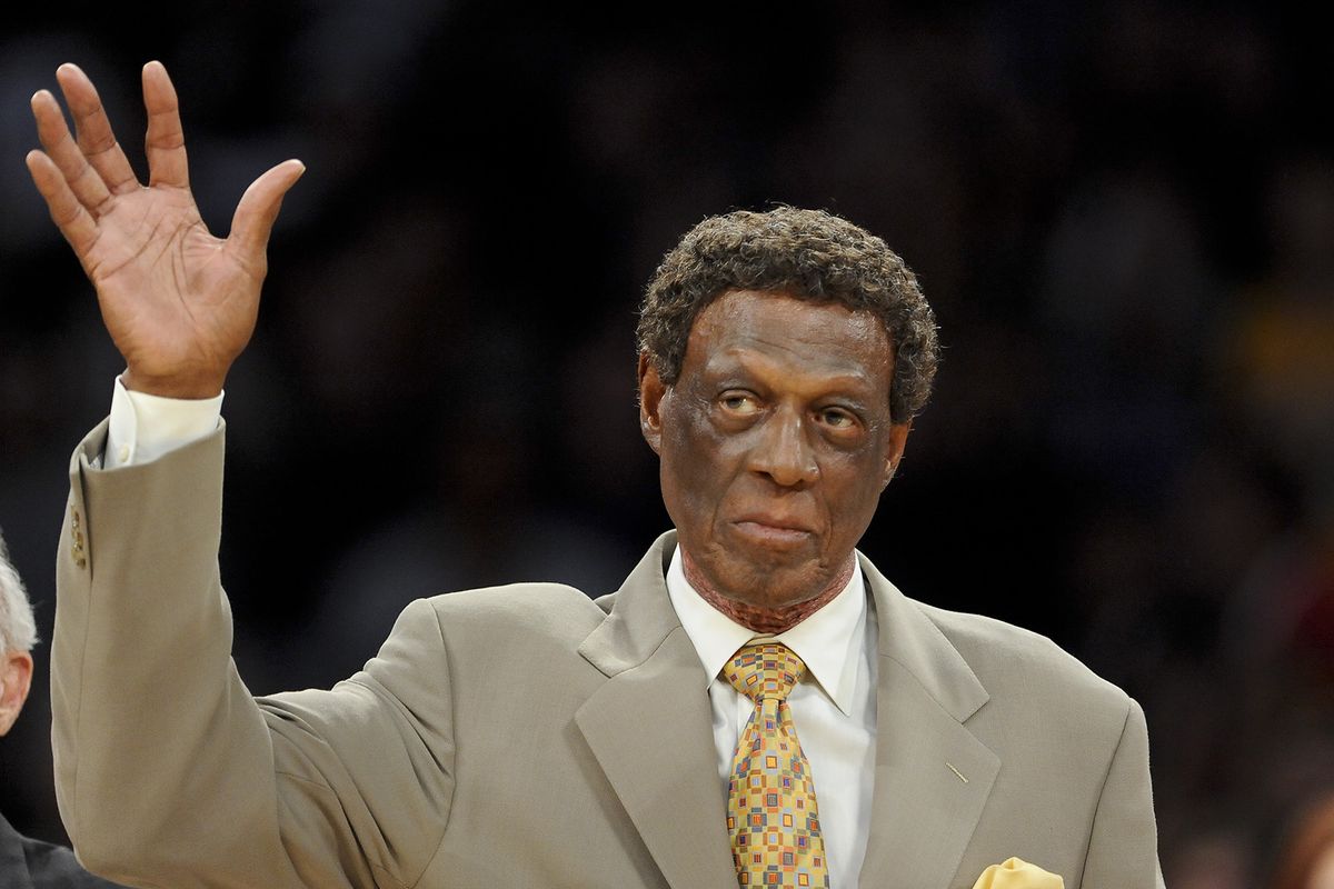 Elgin Baylor waves as he is honored along with other members of the 1974 Los Angeles Lakers Championship team, at half time of an NBA basketball game between the Houston Rockets and the Lakers in Los Angeles, in this Friday, April 6, 2012, filer photo. Elgin Baylor, the Lakers’ 11-time NBA All-Star, died Monday, March 22, 2021, of natural causes. He was 86. The Lakers announced that Baylor died in Los Angeles with his wife, Elaine, and daughter Krystal by his side.  (Gus Ruelas/Associated Press)