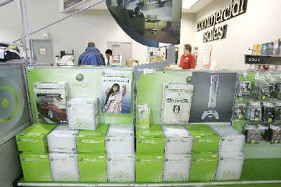 
Boxes containing Microsoft Corp.'s XBox 360 gaming system are shown on display at a CompUSA store in Tukwila, Wash. Xbox sales help boost Microsoft profits during the third quarter.  
 (Associated Press / The Spokesman-Review)