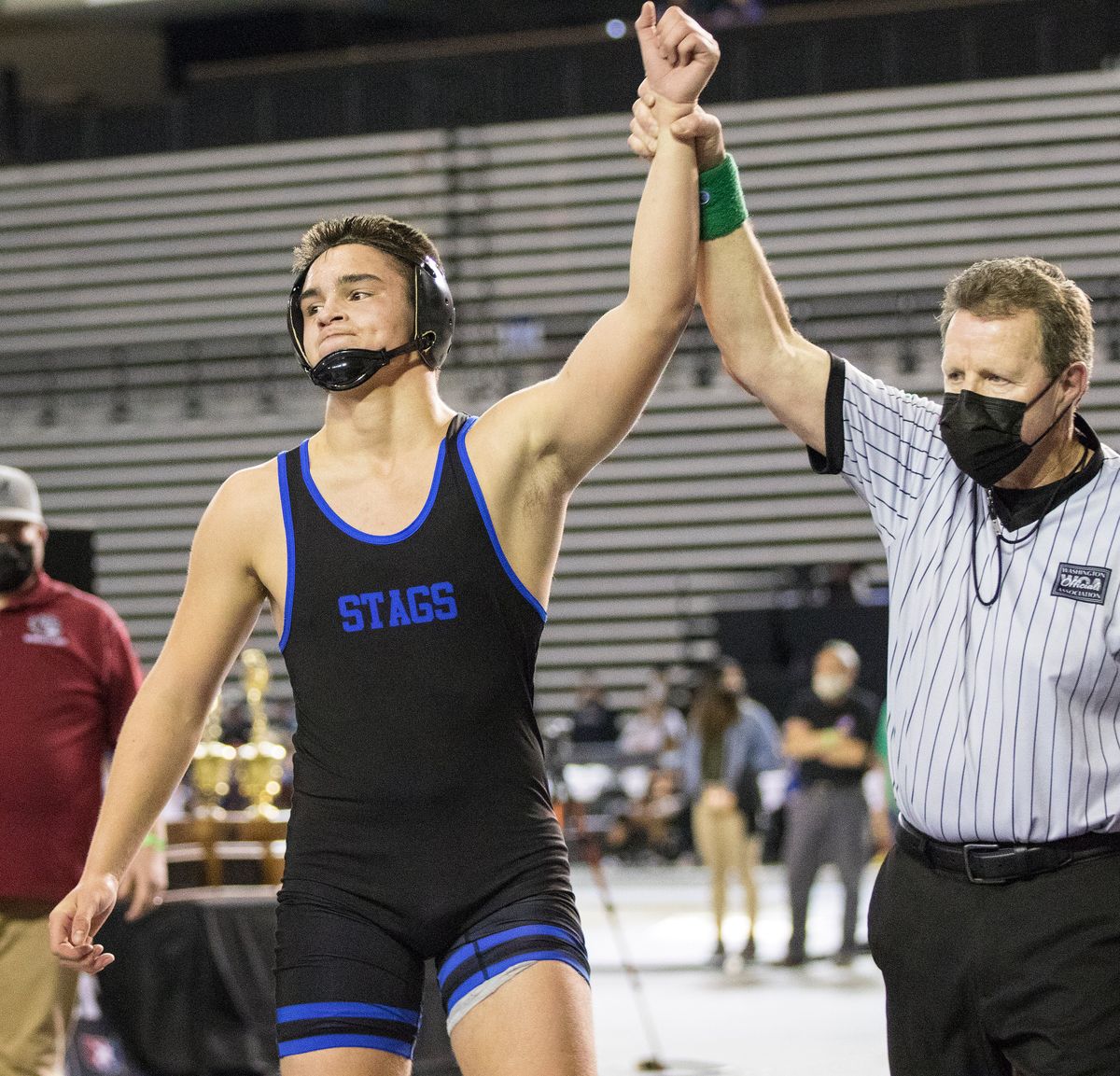 Deer Park’s Bryon Newby has his hand raised after defeating Montesano’s Mateo Sanchez 3-1 in overtime during their 182-pound match at the State 1A Wrestling Championships in Tacoma.  (Patrick Hagerty/Ror The Spokesman-Review)