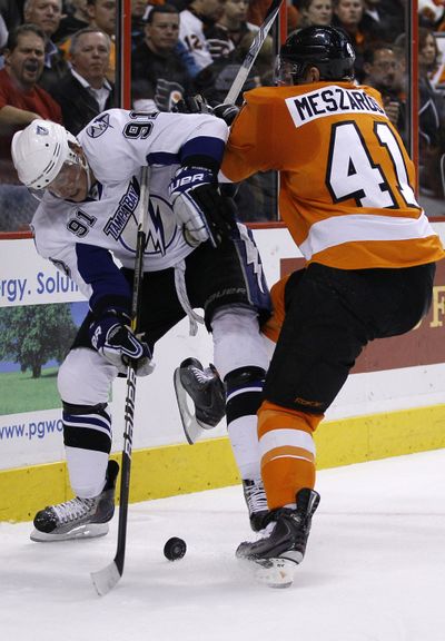 Steven Stamkos, left, had five points in the Lightning’s 8-7 win. (Associated Press)