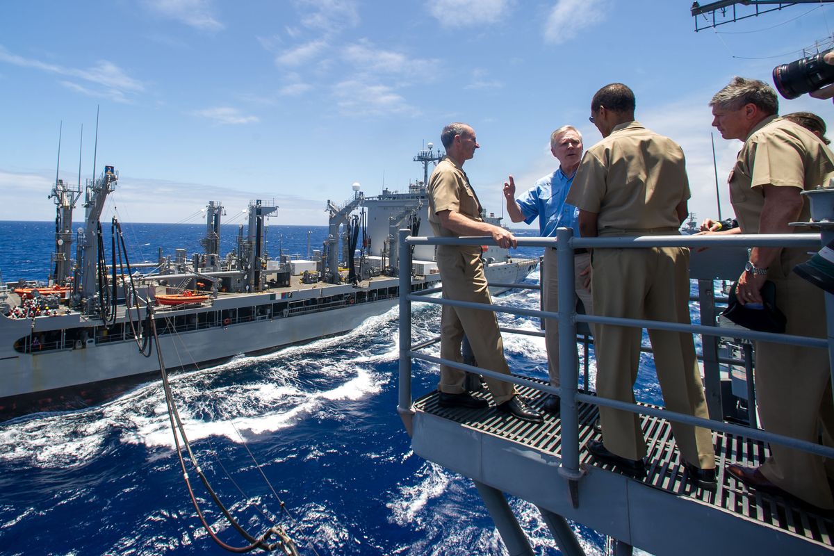 Chief of Naval Operations Adm. Jonathan Greenert, left, and Navy Secretary Ray Mabus observe as the Military Sealift Command fleet replenishment oiler USNS Henry J. Kaiser, background, transfers biofuels to the guided-missile cruiser USS Princeton during a replenishment at sea. The fueling is part of the Navy’s Great Green Fleet demonstration portion of the Rim of the Pacific 2012 exercise. (Associated Press)