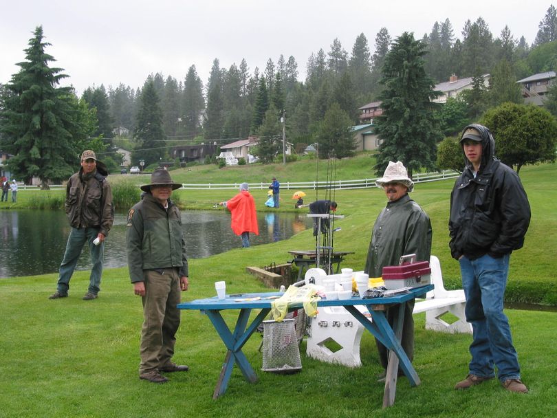 Volunteers help at a Free Fishing Day. From left, Joe Dupont, Bob Moate, Rich Gerhard and Seth Altmeyer. (Courtesy Bureau of Land Management)
