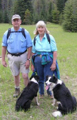 Marianne Love is shown with hubby Bill and two of the family border collies during an outing (Courtesy photo)
