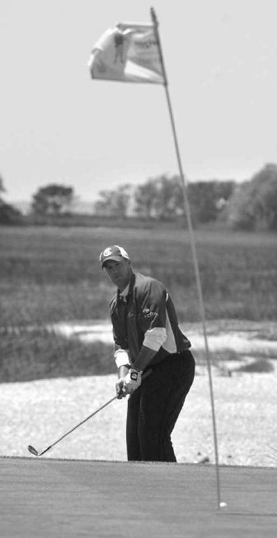 
Boo Weekley watches this chip for par go in on the 18th green Monday to secure the championship of the weather-delayed Verizon Heritage. 
 (Associated Press / The Spokesman-Review)