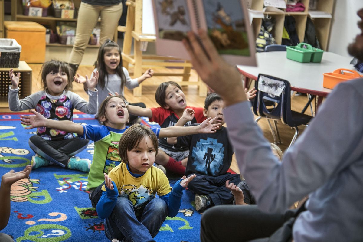 Salish School of Spokane kindergartners participate with teacher Grahm Wiley-Camacho as he reads in Salish from a book that translates to “Jump in the Water and Get Out” during class Friday. The school on Thursday was awarded a $1 million federal grant. (Dan Pelle / The Spokesman-Review)