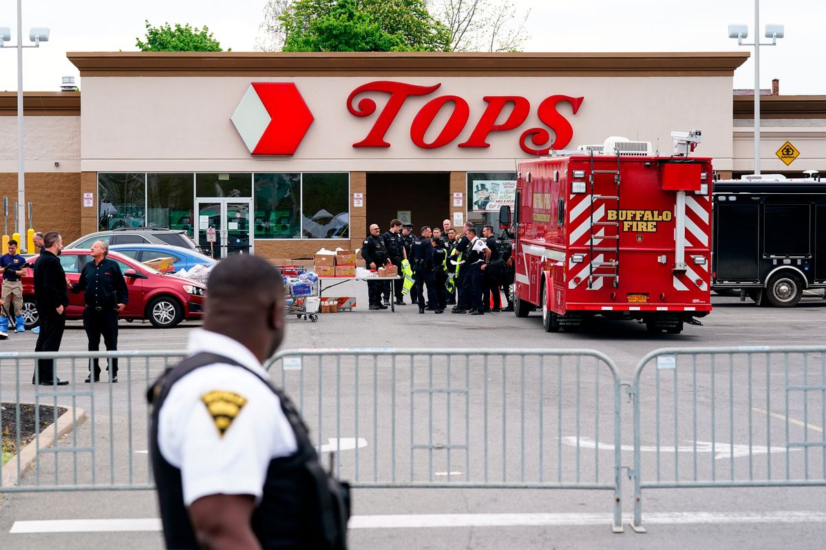 Investigators work the scene of a shooting at a supermarket, in Buffalo, N.Y., Monday, May 16, 2022. (Matt Rourke)