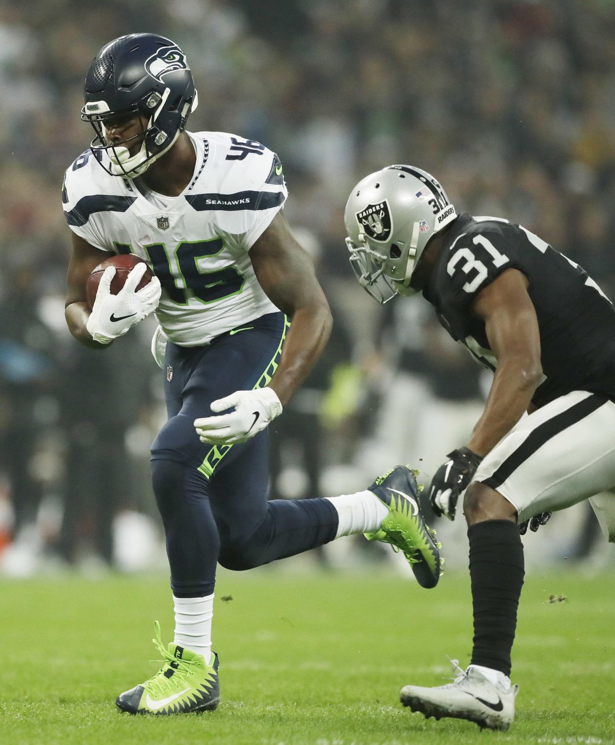 Seahawks’ Tyrone Swoopes runs with the ball during the first half  against the Oakland Raiders  in London on Sunday. (Matt Dunham / AP)