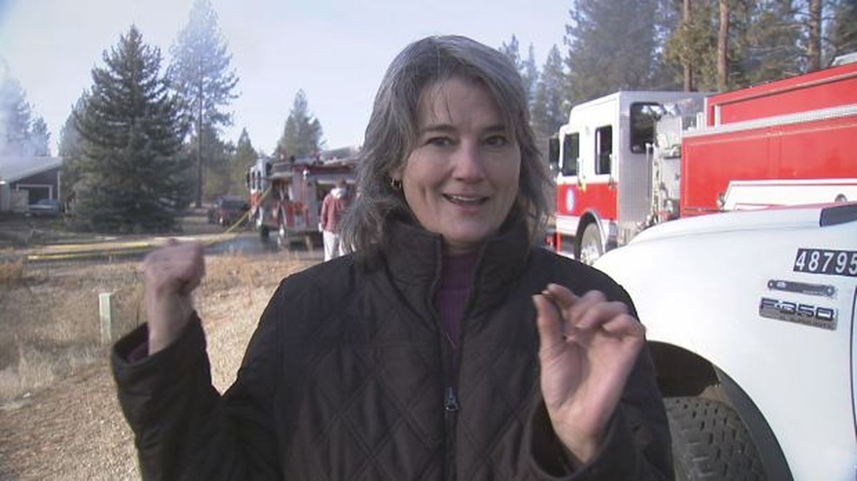 Rose Leeson holds a bullet set off by a house fire she was watching Thursday, Dec. 3, 2009. The bullet hit Leeson but not hard enough to injure her. The manufactured home on Denison-Chattaroy Road in the vicinity of Regal Road was a total loss. (KHQ-TV)