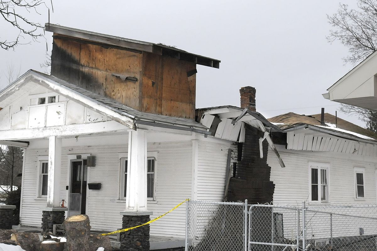 A collapsed roof did extensive damage to this Spokane home, pictured Jan. 10,  during last winter’s heavy snows. This year, home and business owners appear to be thinking ahead about winter maintenance.  (File)