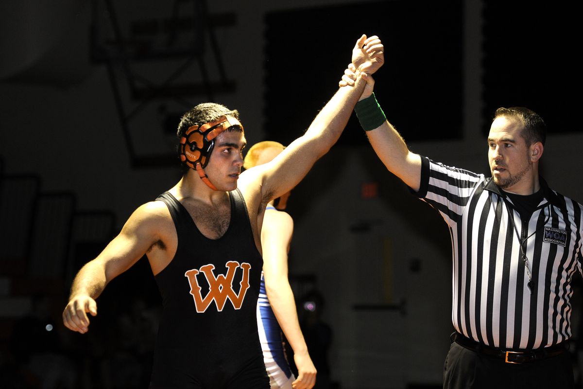 West Valley High School wrestler, Devan Silva, is declared the winner after pinning Pullman's Matt Lyon on Tuesday, Jan. 26, 2010, at West Valley. (Dan Pelle / The Spokesman-Review)