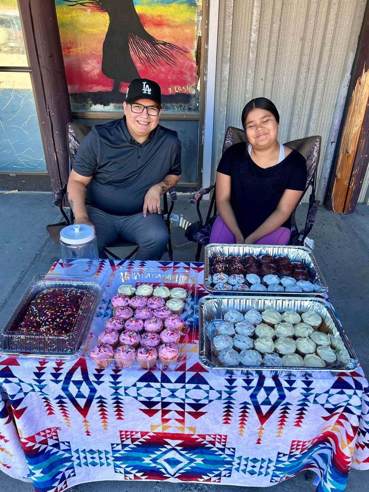 Melody "Sissy" Waskahat, 10, holds a bake sale to raise money for her role as Head Girl Dancer at the Pow-Wow at the Falls this weekend as part of the Expo 