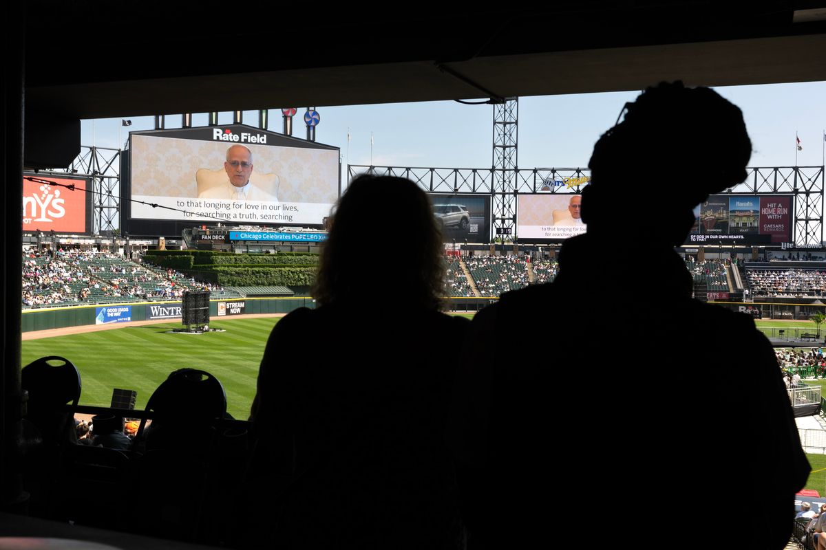 Pope Leo XIV addresses Catholic faithful on the scoreboard at Rate Field, home to the Chicago White Sox, during a celebration and mass to honor his selection as pope on Saturday in Chicago. (Scott Olson)