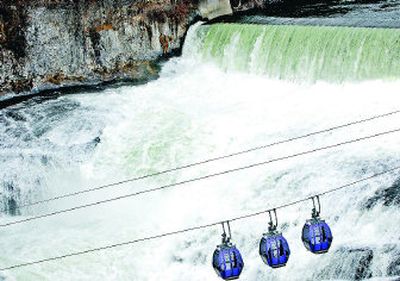
Gondola passengers at Riverfront Park are treated to a view of water crashing over the falls Friday on the Spokane River near the Monroe Street Bridge.  The National Weather Service predicts normal stream flows in the Inland Northwest this spring and summer. 
 (Holly Pickett / The Spokesman-Review)