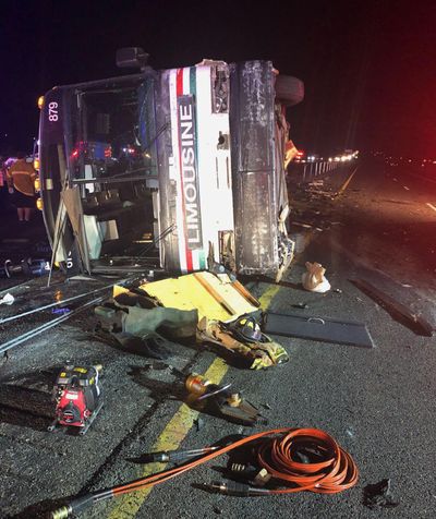 A bus remains on the scene of a multi-vehicle deadly crash Sunday, July 15, 2018, on Interstate 25 just north of Bernalillo, N.M. (Associated Press)