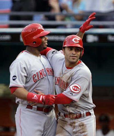 
Jerry Hairston, right, who scored from third base, greets Griffey after his 600th homer. Associated Press
 (Associated Press / The Spokesman-Review)