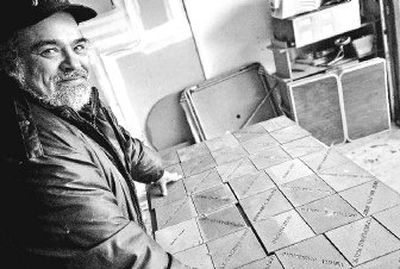 
Lenny Munguia  salvaged hundreds of engraved tiles bought by members of the community to help support Spokane Marketplace and now keeps the tiles stacked in boxes at his Spokane home. Munguia was affiliated with the now-closed Spokane Marketplace for 13 years. 
 (photo by Holly Pickett / The Spokesman-Review)