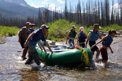 
Photo courtesy of Edwin Hill Edwin Hill (second from right) of Spokane helps his extended family drag rafts down the South Fork of the Flathead River in the last week of July.
 (Photo courtesy of Edwin Hill / The Spokesman-Review)