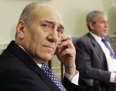 
Israeli Prime Minister Ehud Olmert, left, listens as President Bush speaks during their meeting  at the White House  on Tuesday. The two voiced support for Palestinian President Mahmoud Abbas. Associated Press
 (Associated Press / The Spokesman-Review)