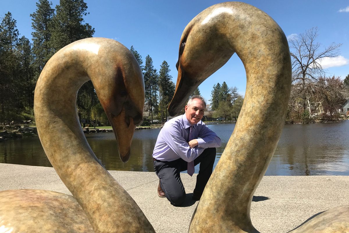Artist Vincent De Felice created the bronze sculpture “Love Birds.” He is pictured shortly after the unveiling ceremony on Wednesday at the Duck Pond at Manito Park.  (Jonathan Brunt/The Spokesman-Review)