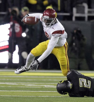 USC freshman receiver Marqise Lee evades Oregon’s Troy Hill on one of his eight catches. (Associated Press)