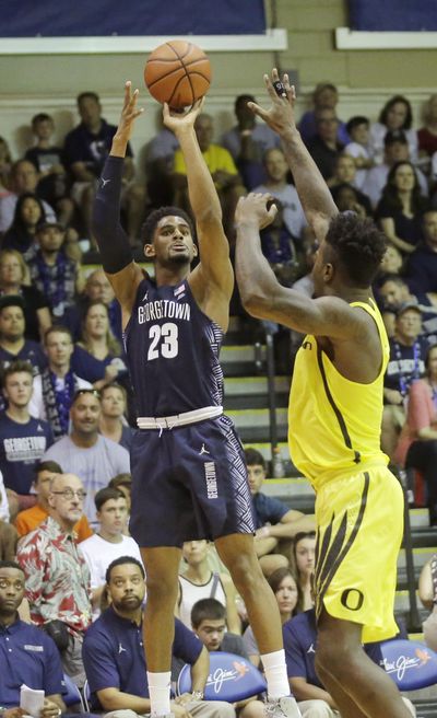 Georgetown guard Rodney Pryor, left, shoots as Oregon forward Jordan Bell defends in the second half during an NCAA college basketball game in the Maui Invitational, Monday, Nov. 21, 2016, in Lahaina, Hawaii. (Rick Bowmer / Associated Press)