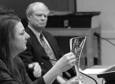 
Cheryl Corrigan, of Spokane, testifies Tuesday before a state Senate panel on a bill by Sen. Chris Marr, D-Spokane, to do away with the statute of limitations for prosecuting sex crimes against children.  At right is former Spokane County Prosecutor Don Brockett, another supporter of the bill.
 (RICHARD ROESLER / The Spokesman-Review)