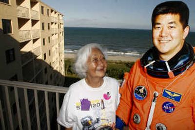 
Rose Tani looks up at a cardboard cutout of her son, astronaut Daniel Tani, in this  Oct. 23 photo. Associated Press
 (Associated Press / The Spokesman-Review)
