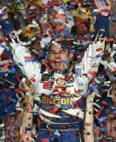 
Confetti falls on Jeff Gordon in Victory Lane after he won the NASCAR Pepsi 400. 
 (Associated Press / The Spokesman-Review)