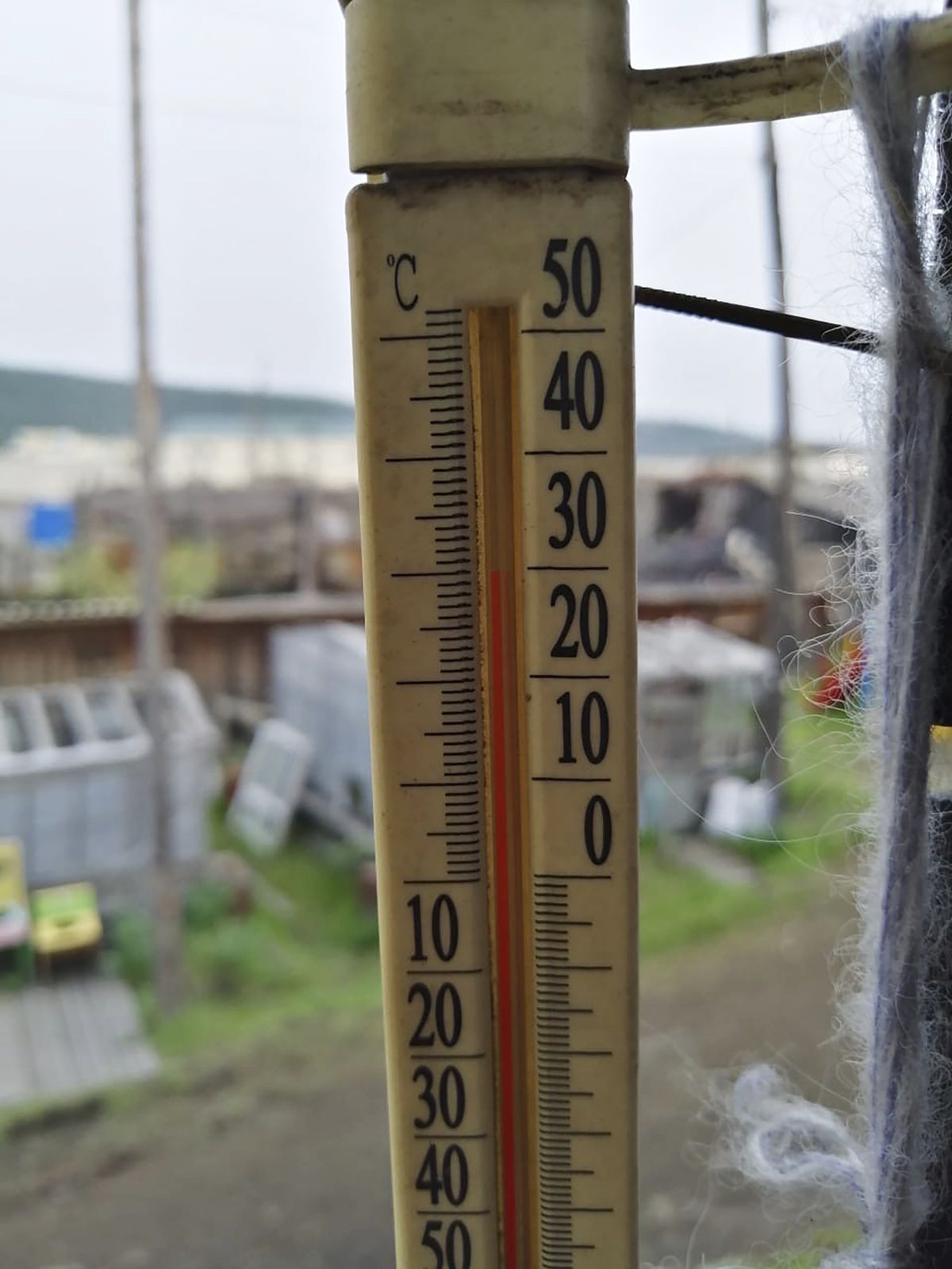 In this handout photo provided by Olga Burtseva, an outside thermometer shows 30 Celsius (86 F) around 11 p.m in Verkhoyansk, the Sakha Republic, about 4660 kilometers (2900 miles) northeast of Moscow, Russia, Sunday, June 21, 2020. A Siberian town that endures the world