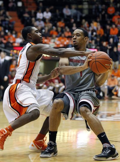 WSU guard Reggie Moore, right, and his teammates turned in a big performance at OSU on Thursday. (Associated Press)