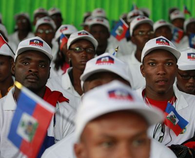 Haitian students attend a ceremony welcoming them to Dakar, Senegal, on Wednesday.  (Associated Press)