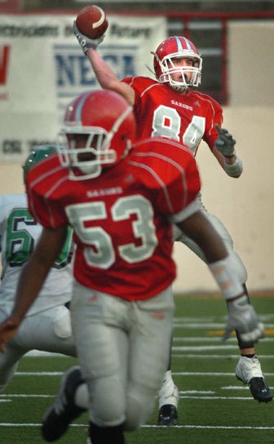 
Ferris wide receiver Jared Karstetter passes to quarterback Shawn Stockton in the second quarter.
 (Holly Pickett / The Spokesman-Review)