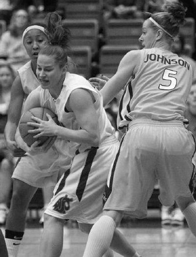 
Arizona State's Briann January, left, and Aubree Johnson defend WSU's Katie Appleton Saturday.
 (Associated Press / The Spokesman-Review)