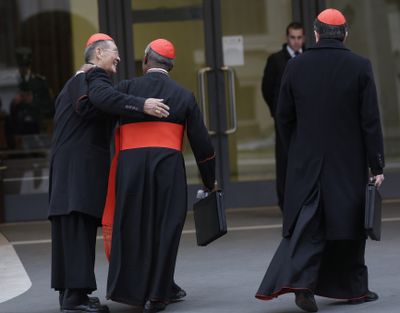 Vietnamese Cardinal Jean-Baptiste Pham Minh Man, left, arrives for a meeting at the Vatican on Thursday. (Associated Press)