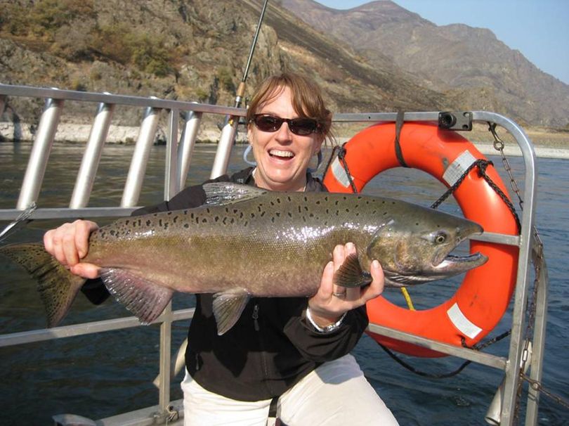 Amy Sinclair of Riggins holds a chinook salmon she caught while targeting steelhead near the confluence of the Snake and Salmon rivers last week. (Courtesy photo)