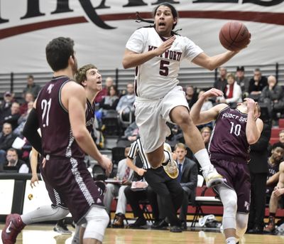 Whitworth guard Kenny Love  passes the ball  against Puget Sound during the first half  Friday  at Whitworth. (Tyler Tjomsland / The Spokesman-Review)