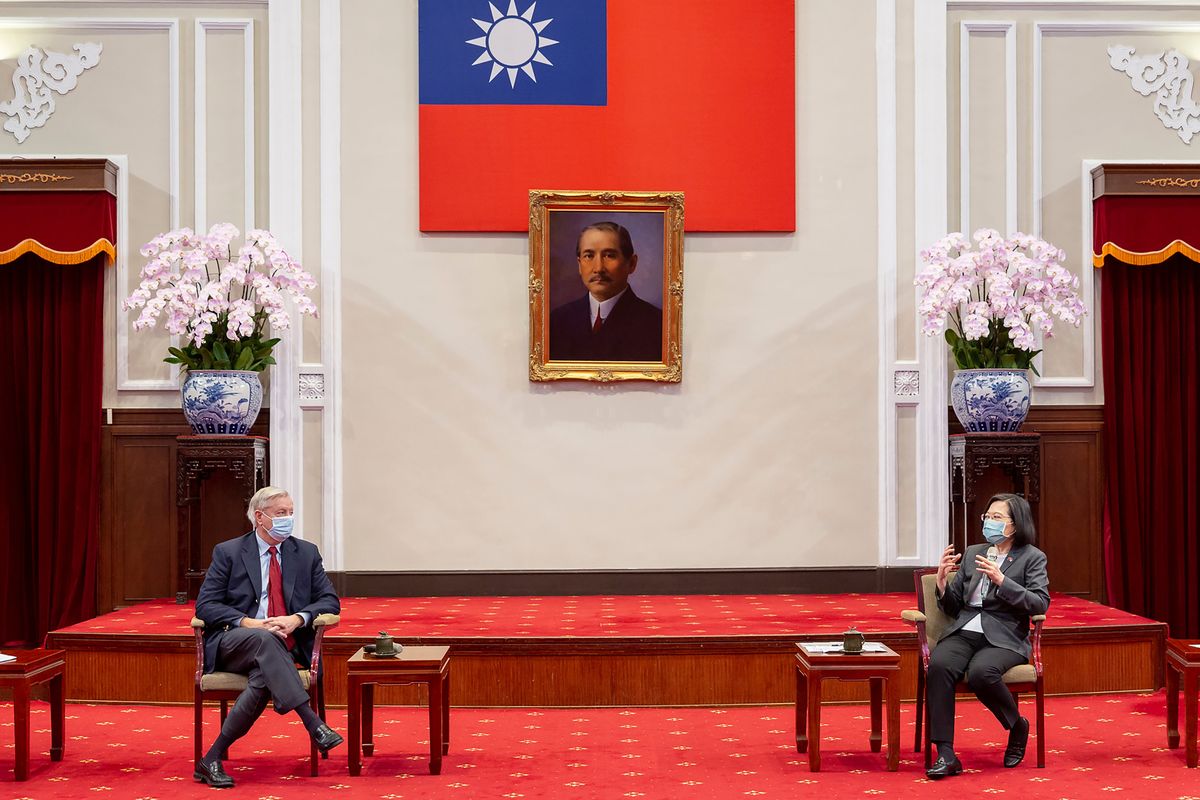 In this photo released by the Taiwan Presidential Office, Sen. Lindsey Graham, R-S.C., left, listens as Taiwan