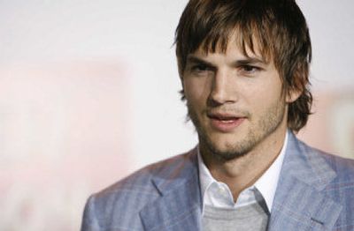 
Actor Ashton Kutcher poses for photographers at the premiere of 