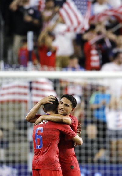 U.S. midfielder Wil Trapp (6) and midfielder Cristian Roldan  celebrate the team’s 1-0 win over Panama in a CONCACAF Gold Cup soccer match in Kansas City, Kan., on Wednesday. (Colin E. Braley / AP)