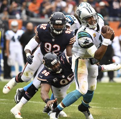 Chicago Bears defensive end Akiem Hicks (96) and outside linebacker Pernell McPhee (92) close in on Carolina Panthers quarterback Cam Newton (1) during an NFL football game in Chicago, Ill. , Sunday, Oct. 22, 2017. (Rick West / Daily Herald via AP)