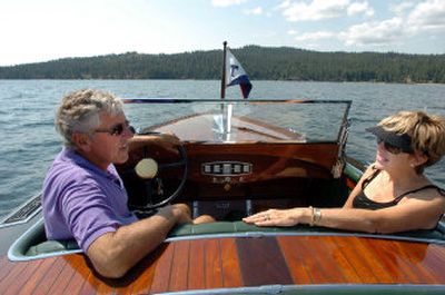 
Brad and Sandi Hill chat in the cockpit of 1929 Gar Wood  28-foot runabout on Lake Coeur d'Alene on Thursday. The retired dentist and his wife will have their boat in the annual Wooden Boat Festival this weekend in Coeur d'Alene. 
 (Jesse Tinsley / The Spokesman-Review)