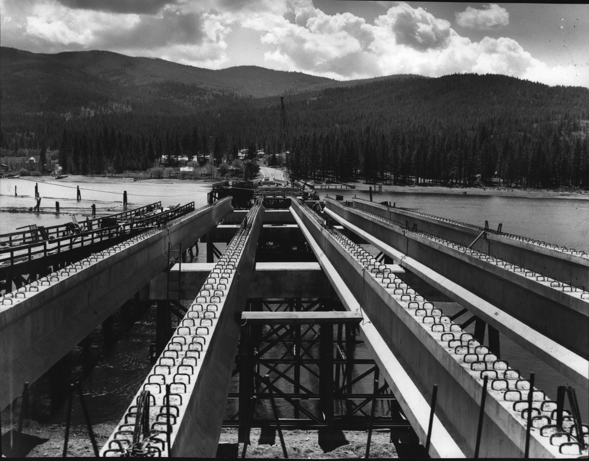 1972: Pre-stressed concrete girders on steel supports on concrete pilings are in place on the 900-foot bridge built across the Spokane River in Post Falls to replace a narrow span that closed in March 1971 after a section collapsed, killing one man. Construction was done by Willamette Western Corp. of Portland. Voters approved a bond issue of $140,000 because deeper bridge pilings were required, but the project was expected to be ready for traffic by late summer, according to Wayne Lowell, project manager for Willamette. It opened in October 1972.  (The Spokesman-Review Photo Archives)